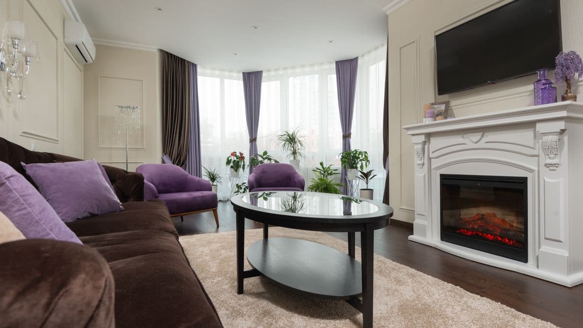 Softly lit, uncluttered living room designed as a calm recovery space after overload